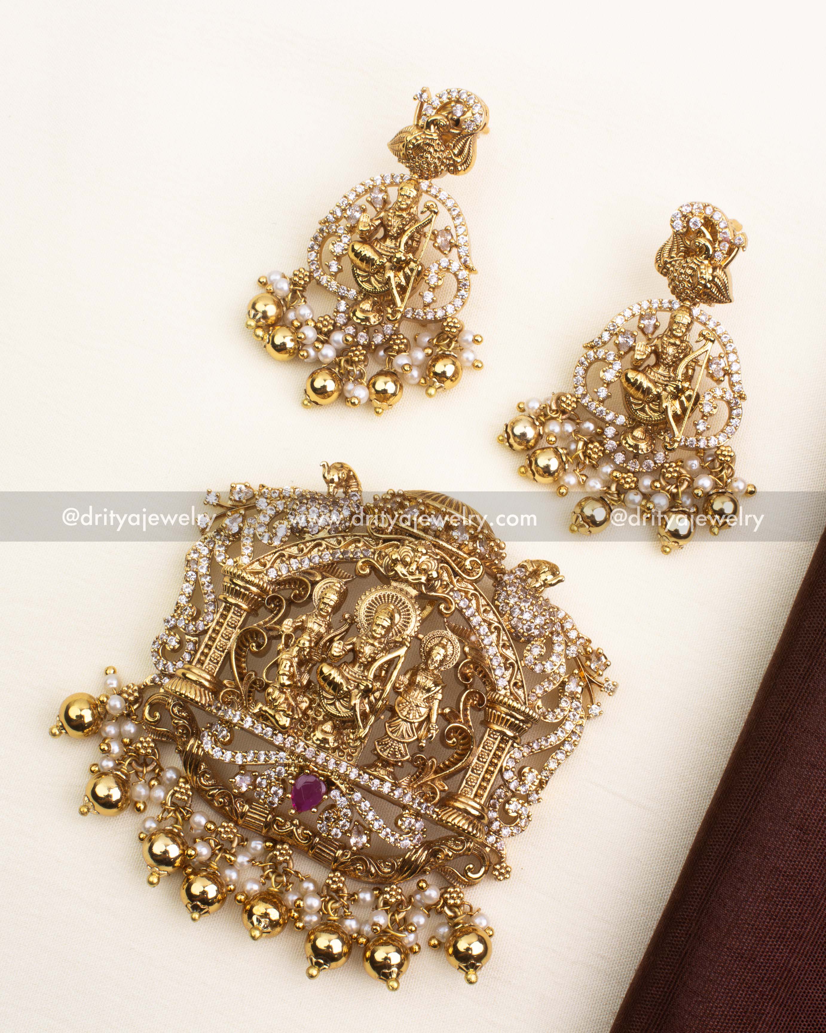 Premium Nakshi pendant set featuring Ram Parivar design with CZ stones, ruby accent, and golden bead drops.