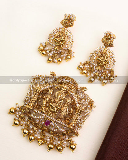 Premium Nakshi pendant set featuring Ram Parivar design with CZ stones, ruby accent, and golden bead drops.