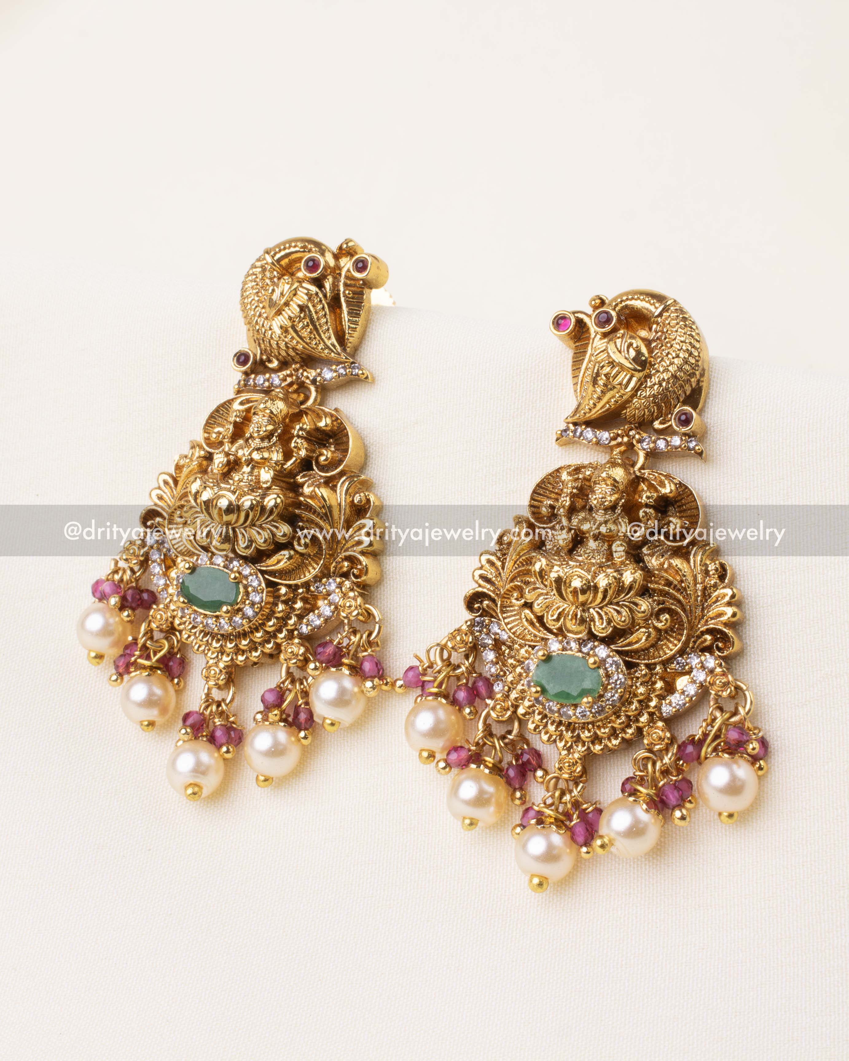 Antique gold dangler earrings with pink beads, pearl drops, and goddess motif.