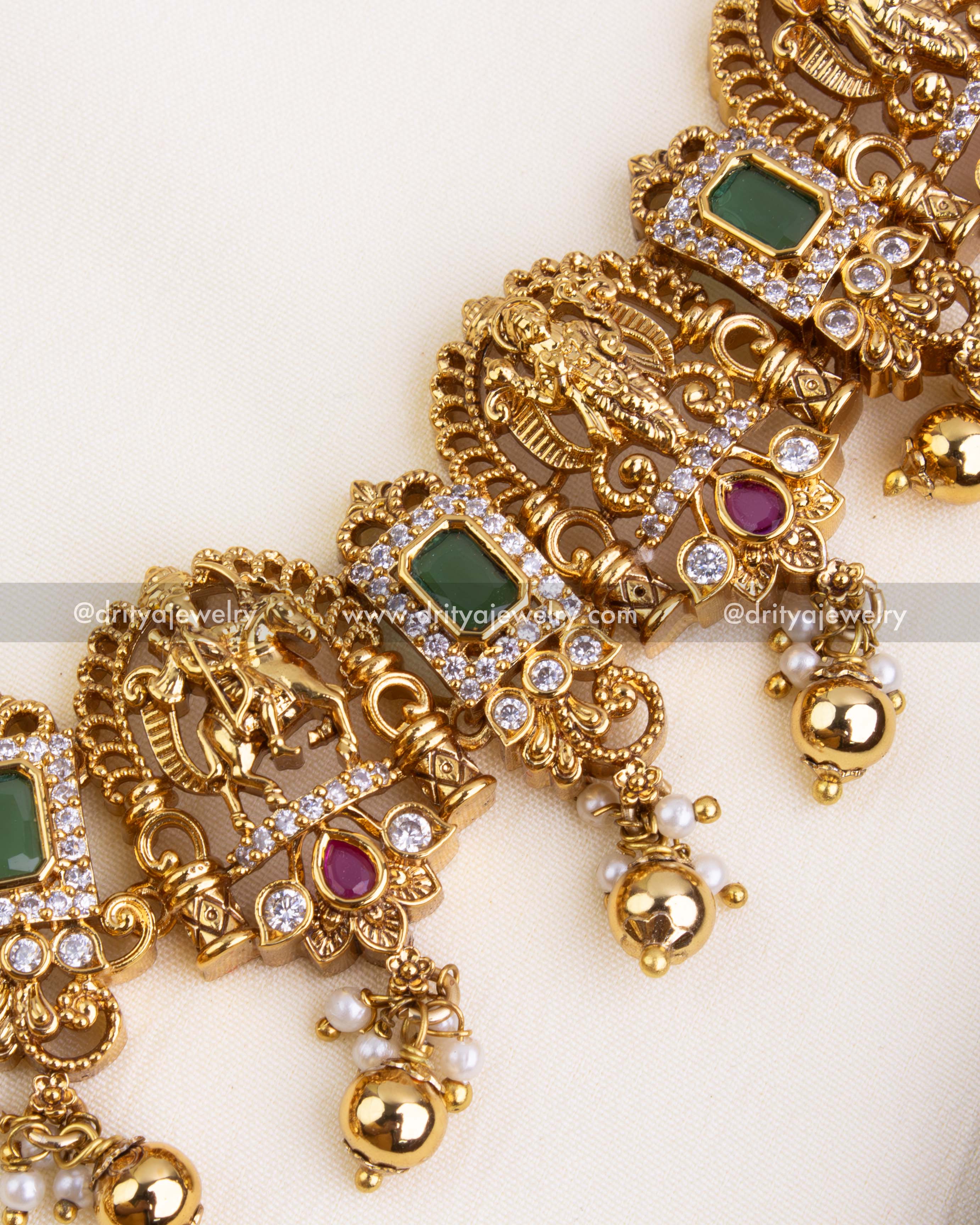 Detailed view of Lord Narasimha motif flanked by peacocks and accented with CZ and colored stones.
