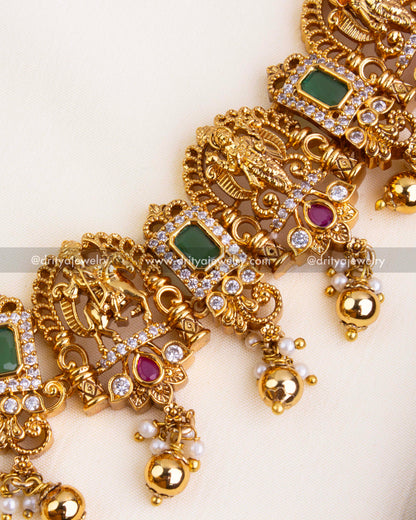 Detailed view of Lord Narasimha motif flanked by peacocks and accented with CZ and colored stones.