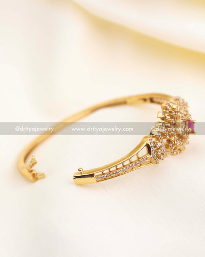 Openable kada showing clasp detail and CZ-studded band.