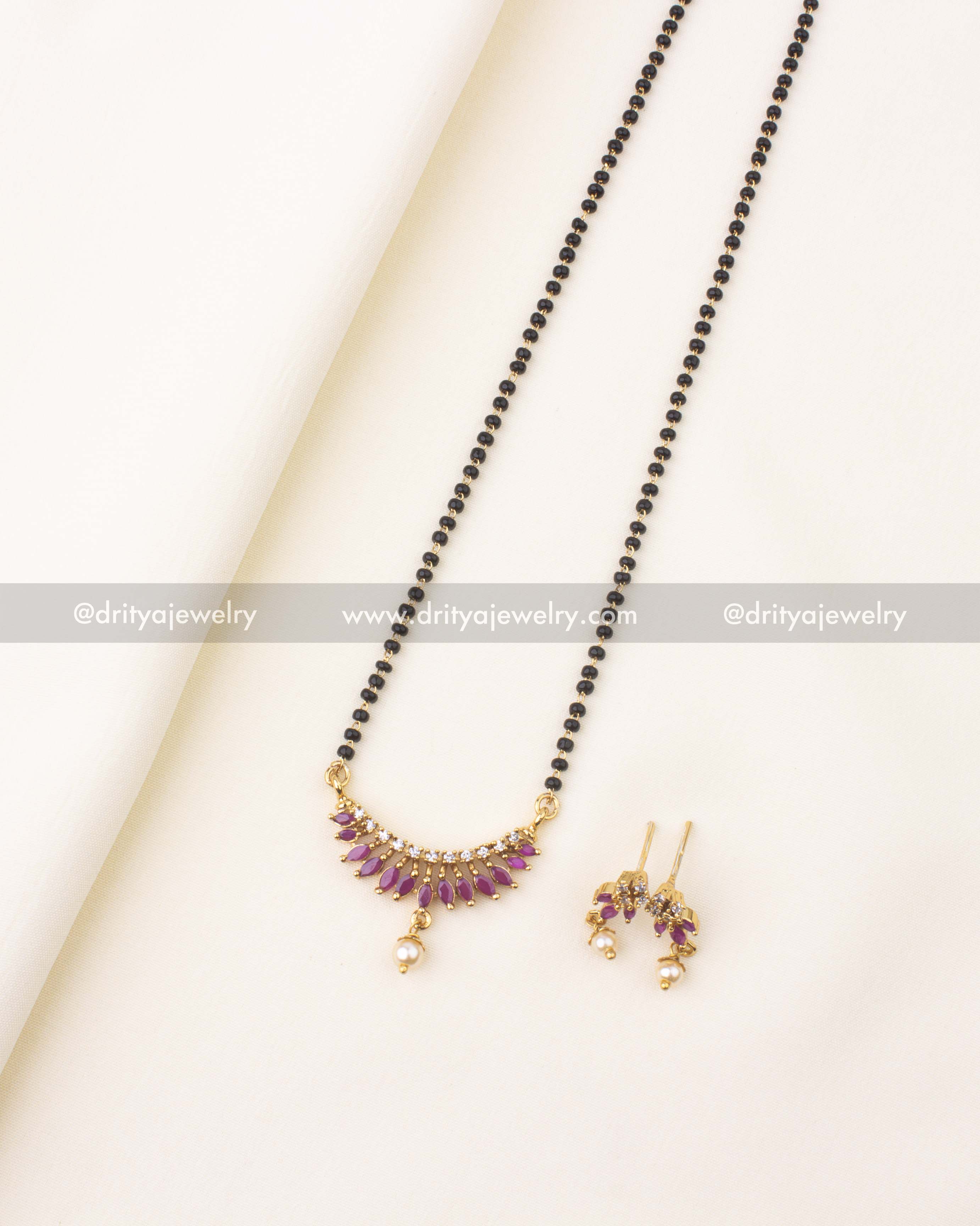 18-inch black beads necklace with pink stones, CZ sparkle, and pearl drops.