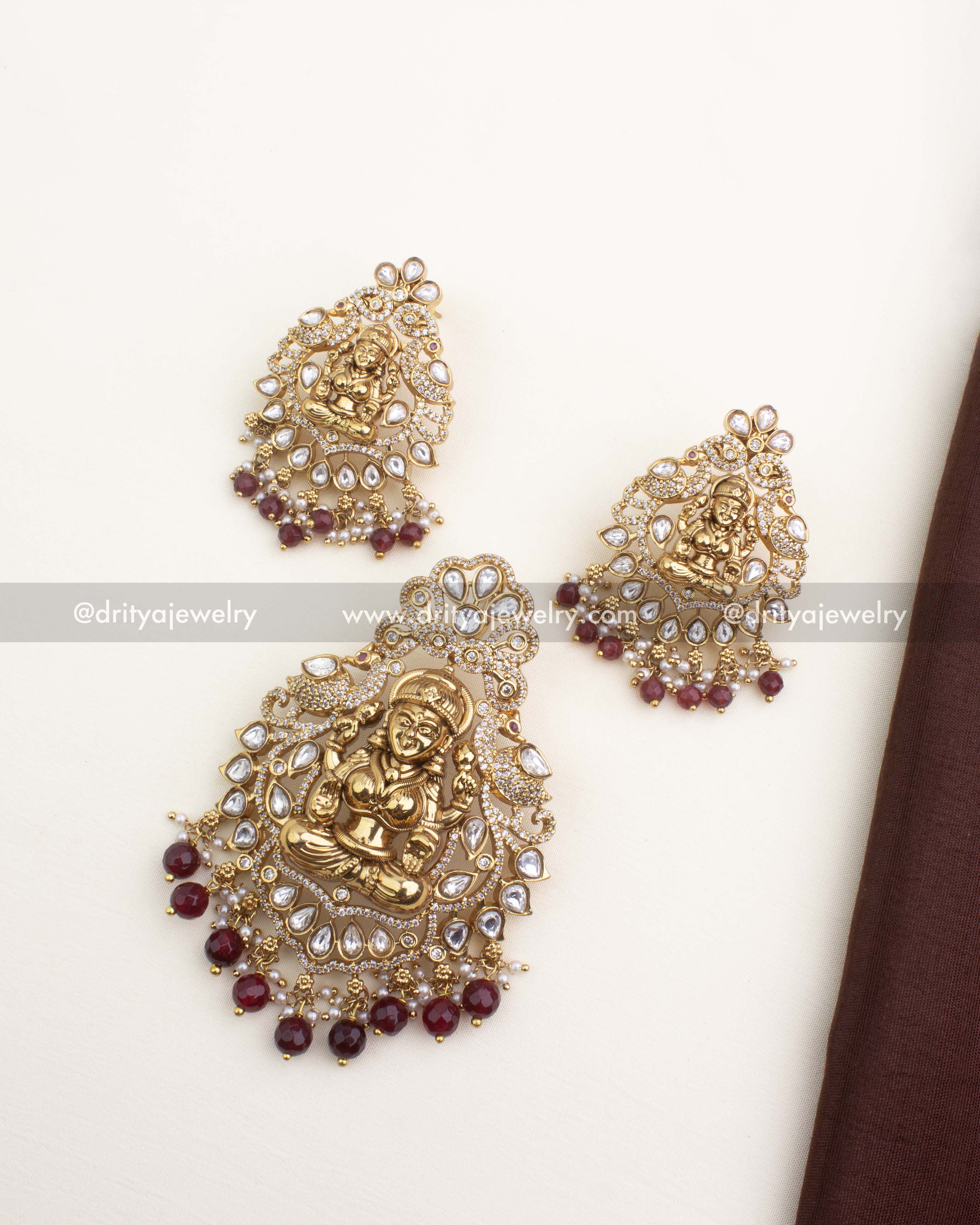Premium temple pendant set with Lakshmi motif, polki kundan stones, CZ detailing, and ruby bead drops