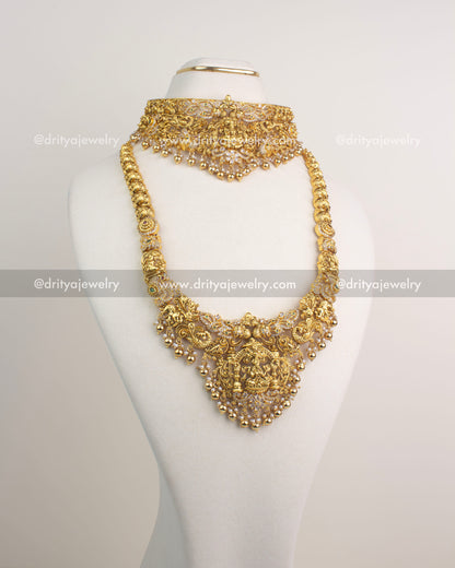 Antique gold combo set with choker, long necklace, and jhumka earrings featuring Lakshmi Devi motifs.
