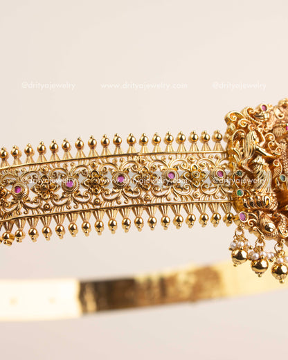 Side view showing detailed floral filigree pattern and gold-plated temple craftsmanship.