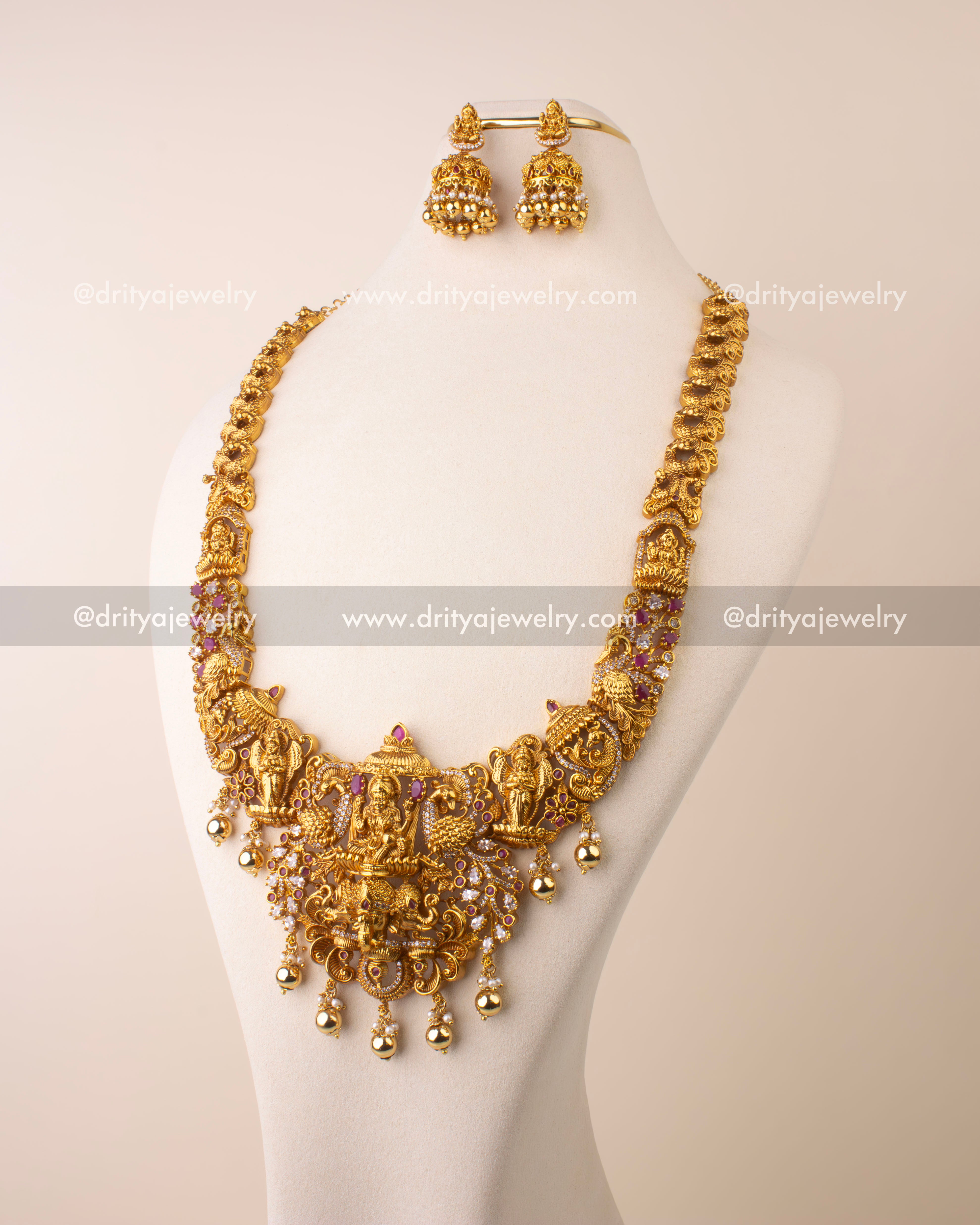 Antique gold replica temple necklace featuring Goddess Lakshmi pendant with Kemp and CZ stone detailing.