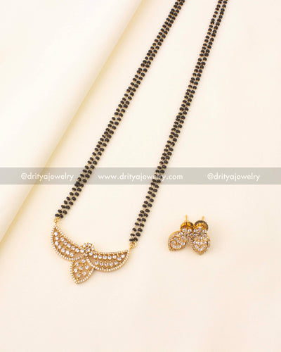 Elegant 24-inch black beads necklace with CZ stone pendant and gold finish.