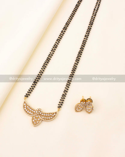 Elegant 24-inch black beads necklace with CZ stone pendant and gold finish.