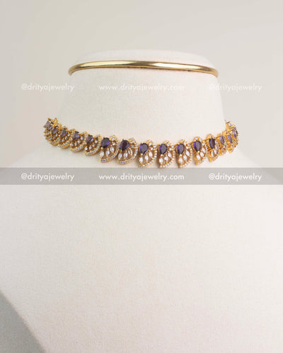 Purple CZ short necklace with gold polish and matching stud earrings.