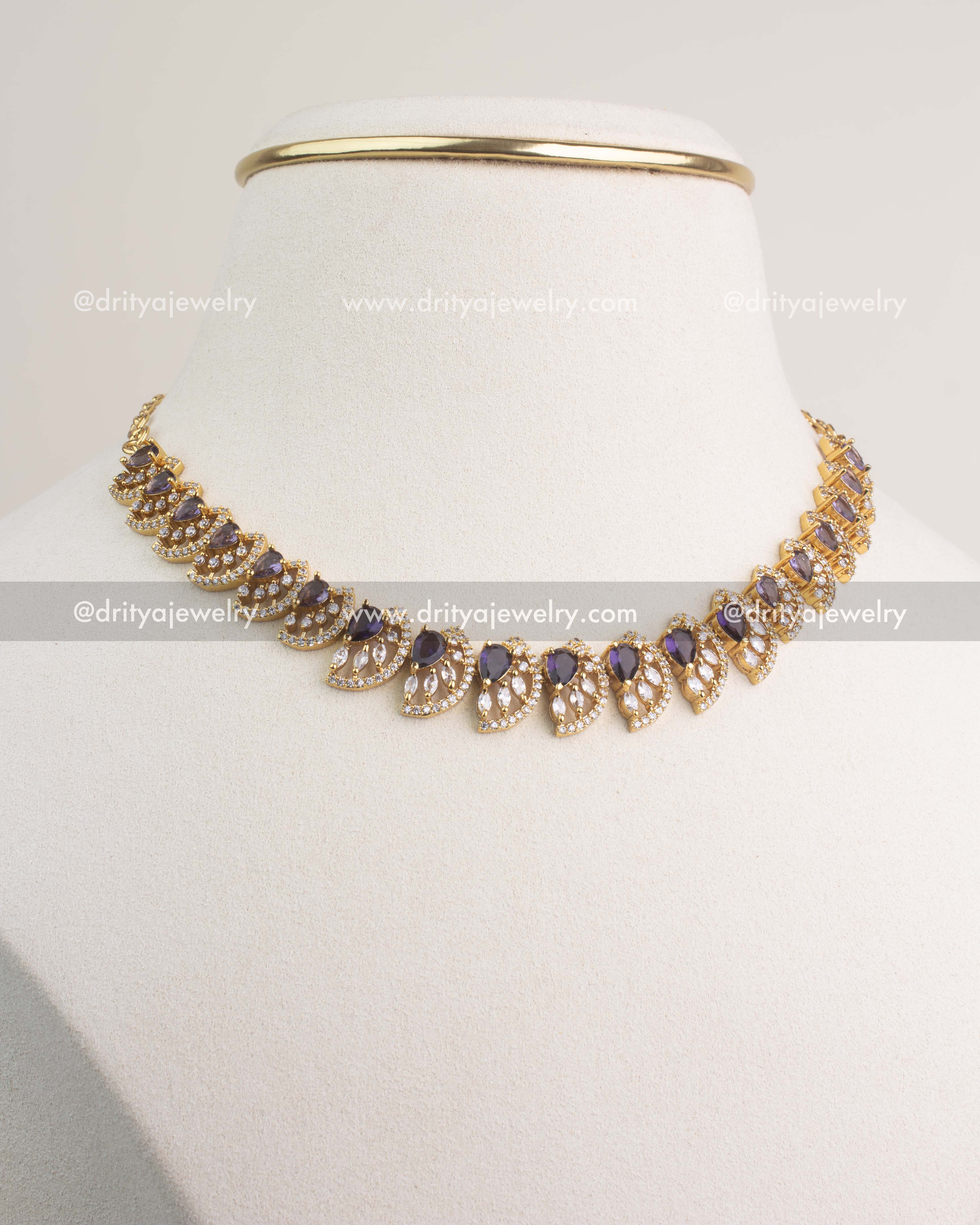 Purple CZ short necklace with gold polish and matching stud earrings.