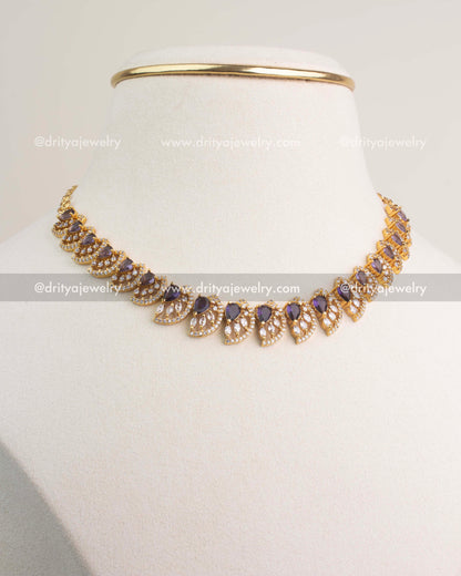 Purple CZ short necklace with gold polish and matching stud earrings.