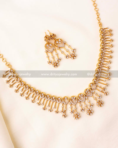 Gold-plated CZ short necklace with teardrop motifs and dangling floral drops