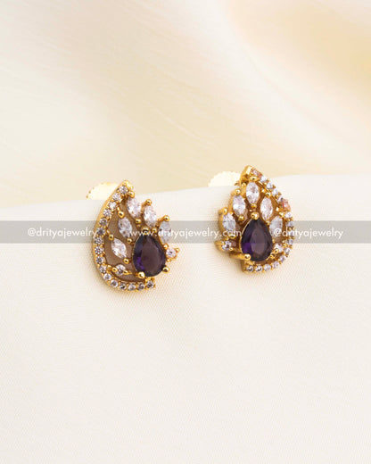 Gold-plated stud earrings with purple center stone and white CZ accents.