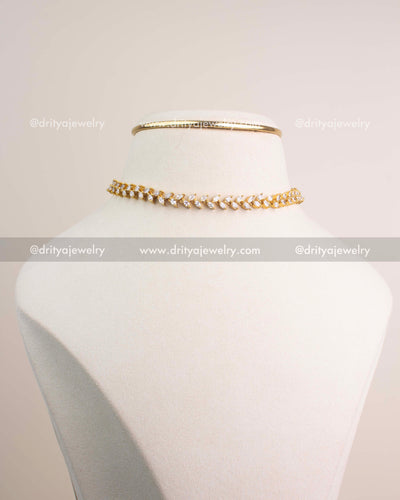 Premium gold climber necklace and matching CZ climber earrings displayed together.