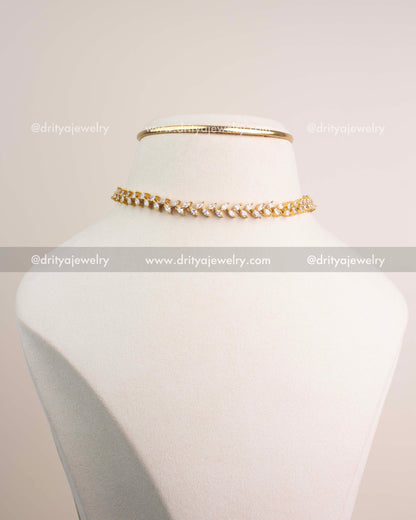 Premium gold climber necklace and matching CZ climber earrings displayed together.