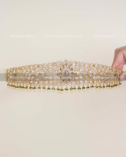 Diamond replica bridal waist belt with floral CZ design and pearl-green bead hangings.