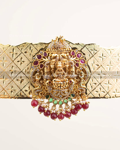 Close view of central Goddess Lakshmi carving with CZ and ruby-emerald embellishments.