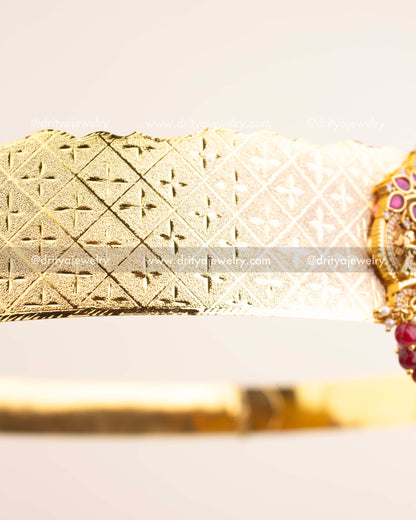 Side profile highlighting geometric belt engraving and intricate Nakshi detailing.