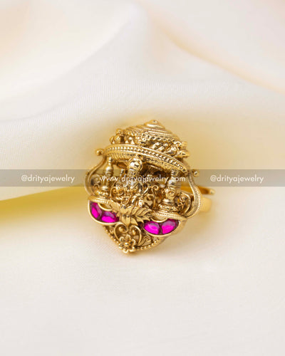 Antique gold adjustable Kemp finger ring with ruby-tone stones and temple detailing