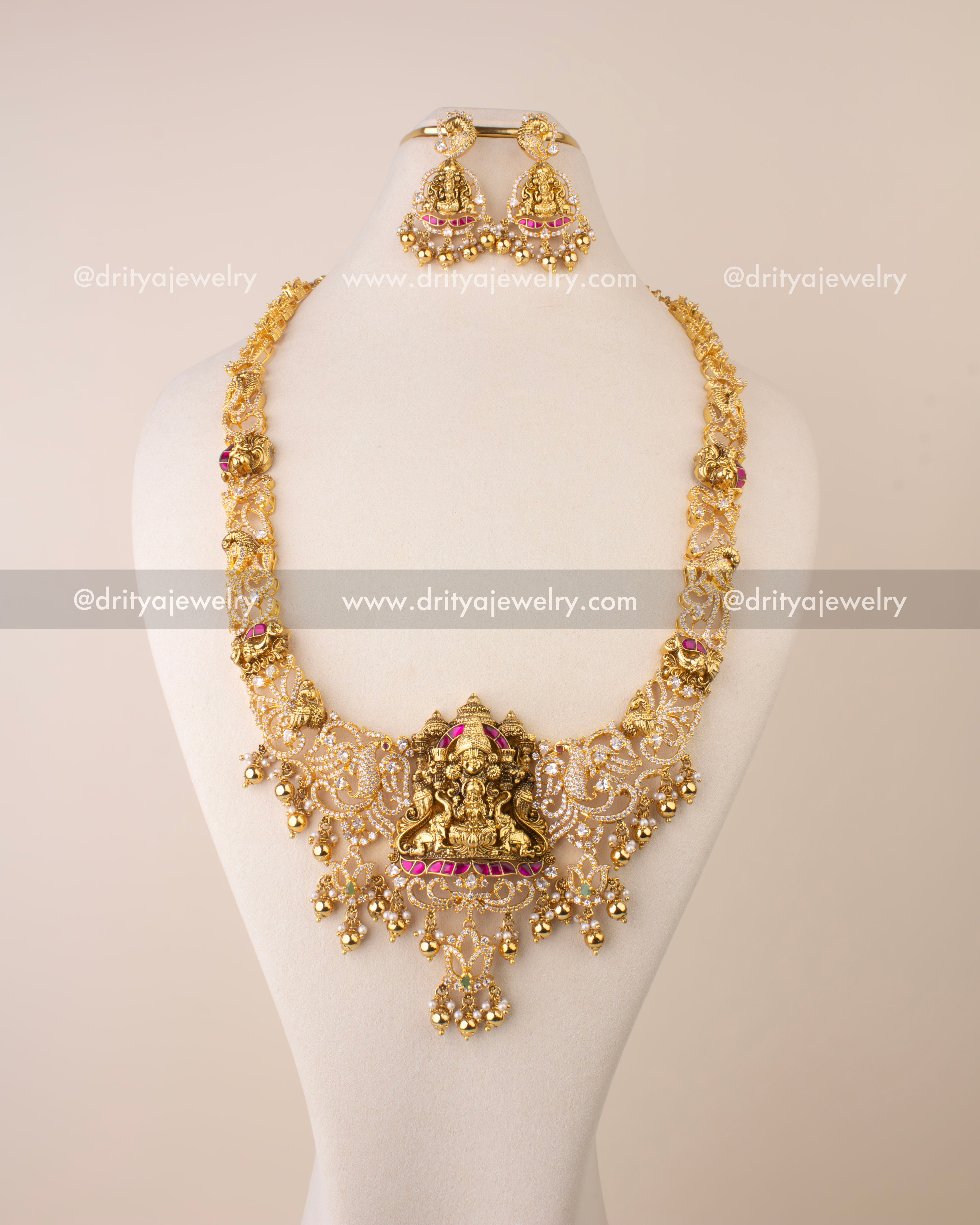 Nakshi long necklace featuring Goddess Lakshmi pendant, Kemp accents, CZ stones, and golden bead drops.