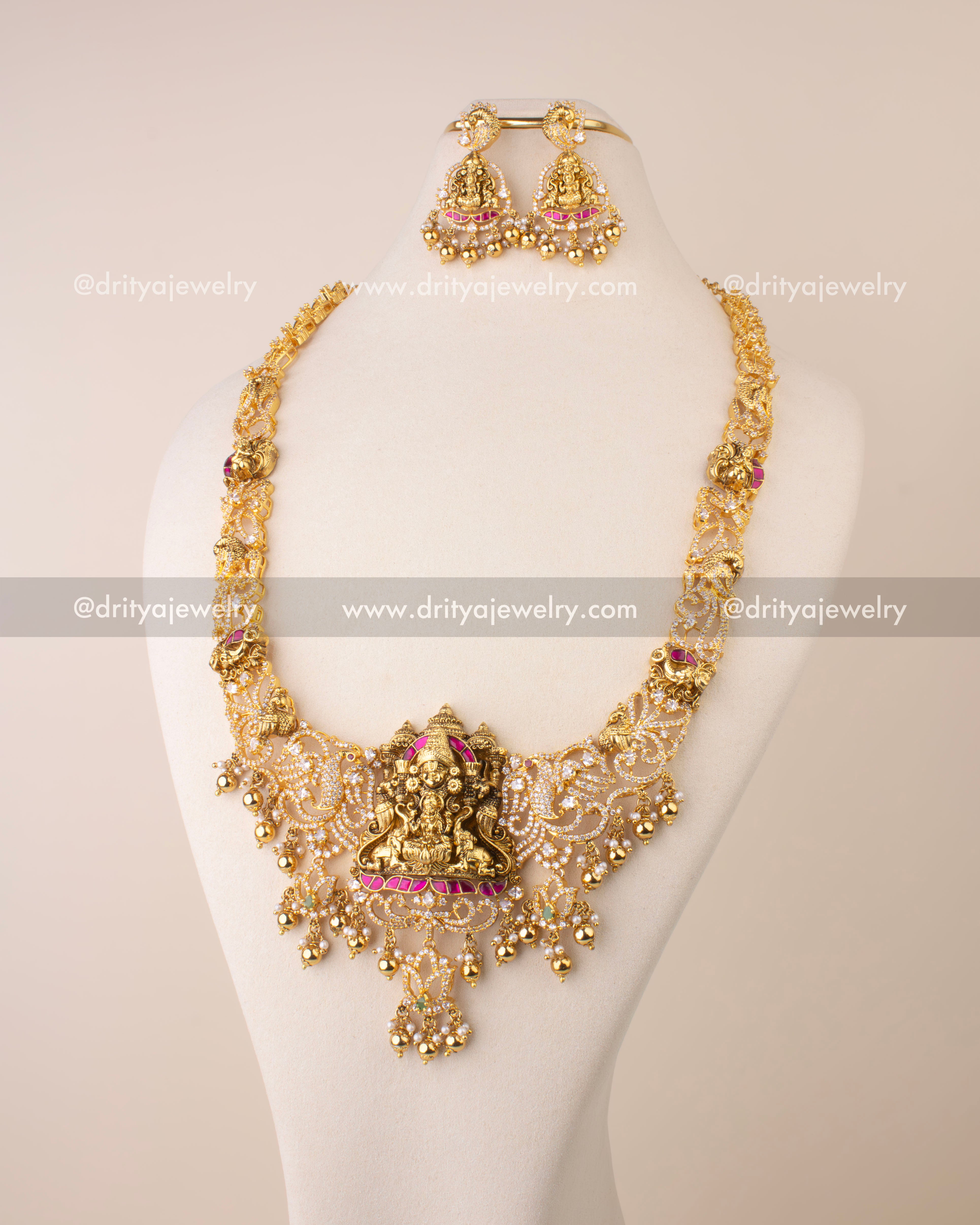 Nakshi long necklace featuring Goddess Lakshmi pendant, Kemp accents, CZ stones, and golden bead drops.