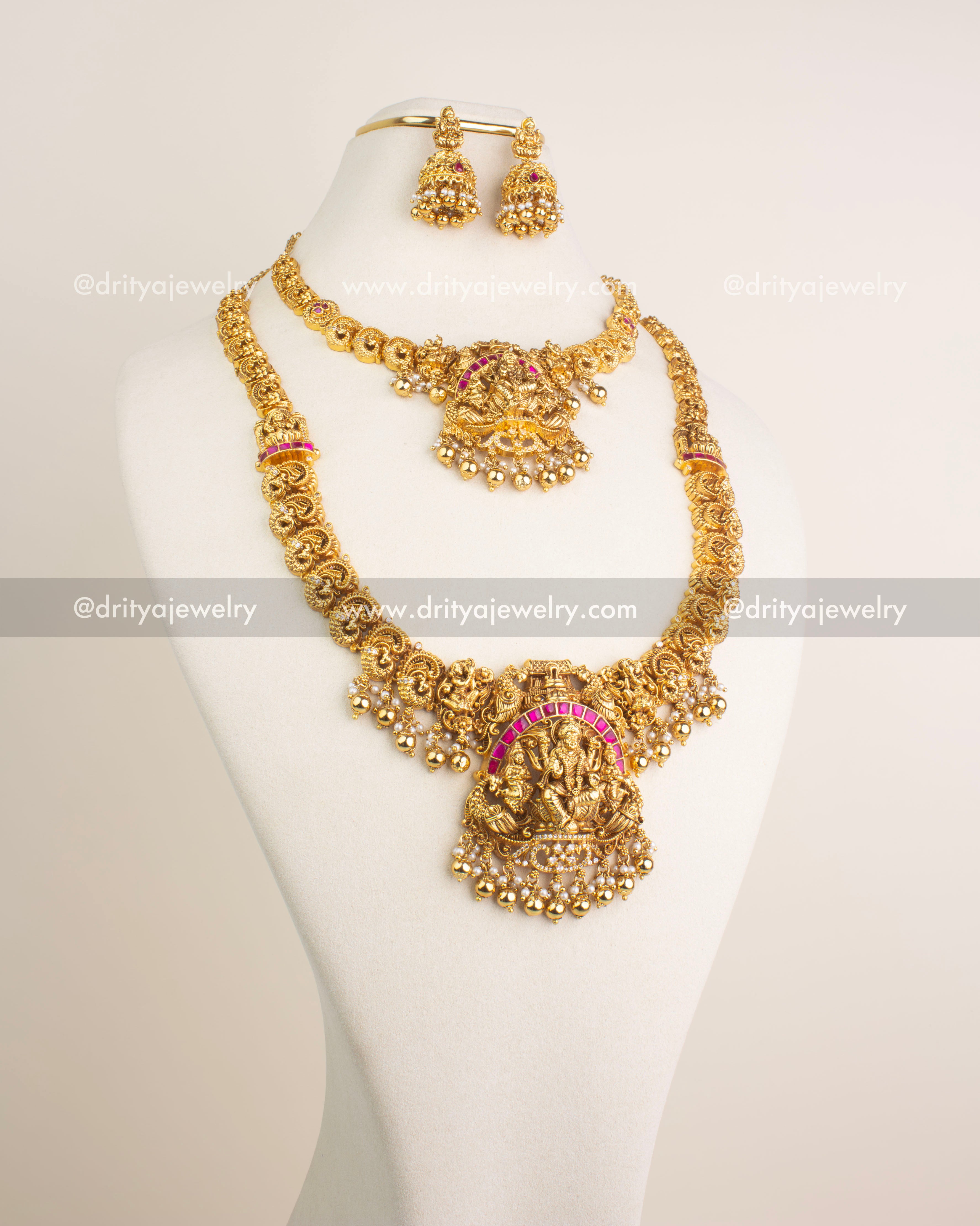 Temple jewelry combo set featuring long and short necklaces with Lakshmi motifs, kemp stones, and antique gold finish.