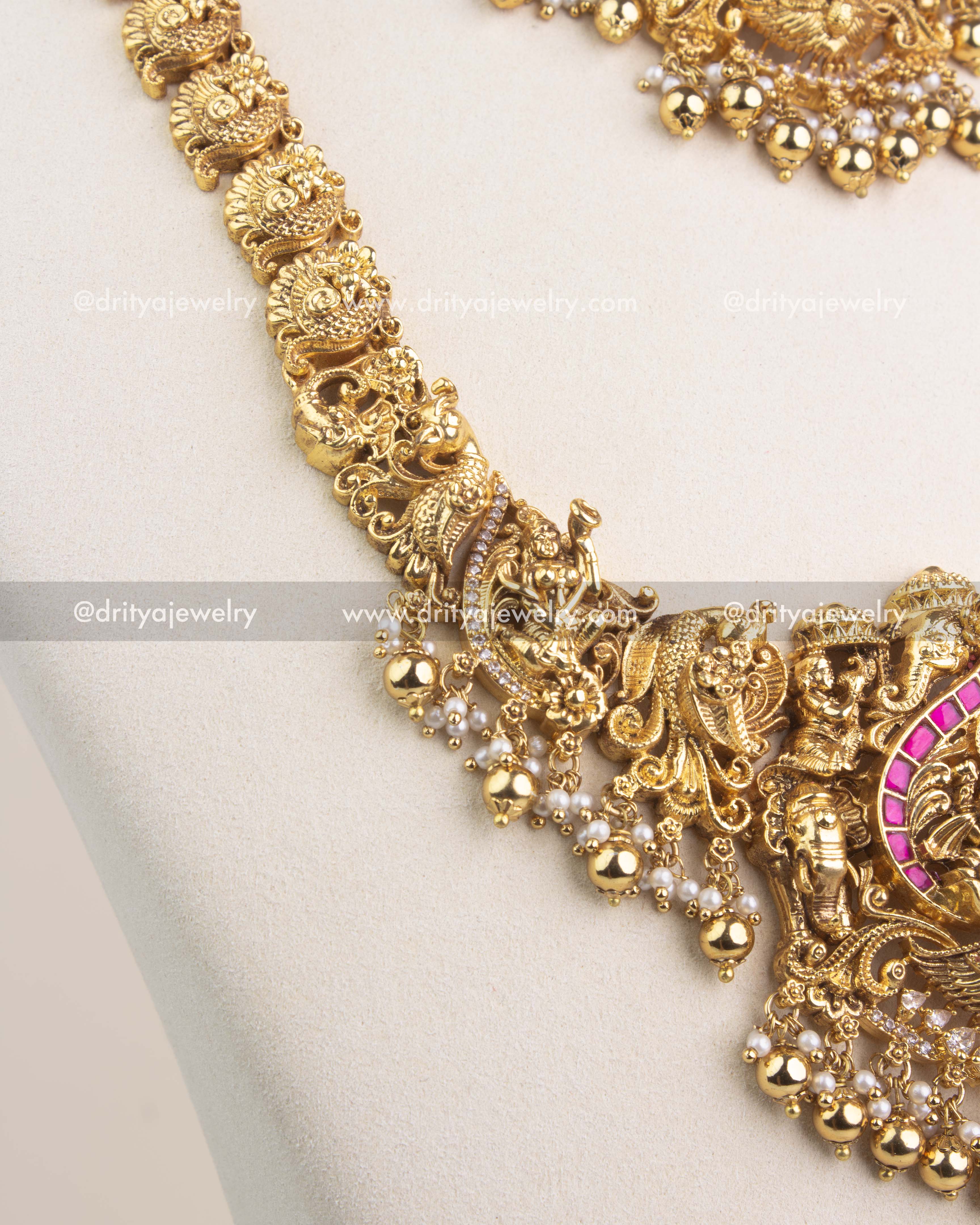 Nakshi chain design with peacock motifs and intricate antique gold work.