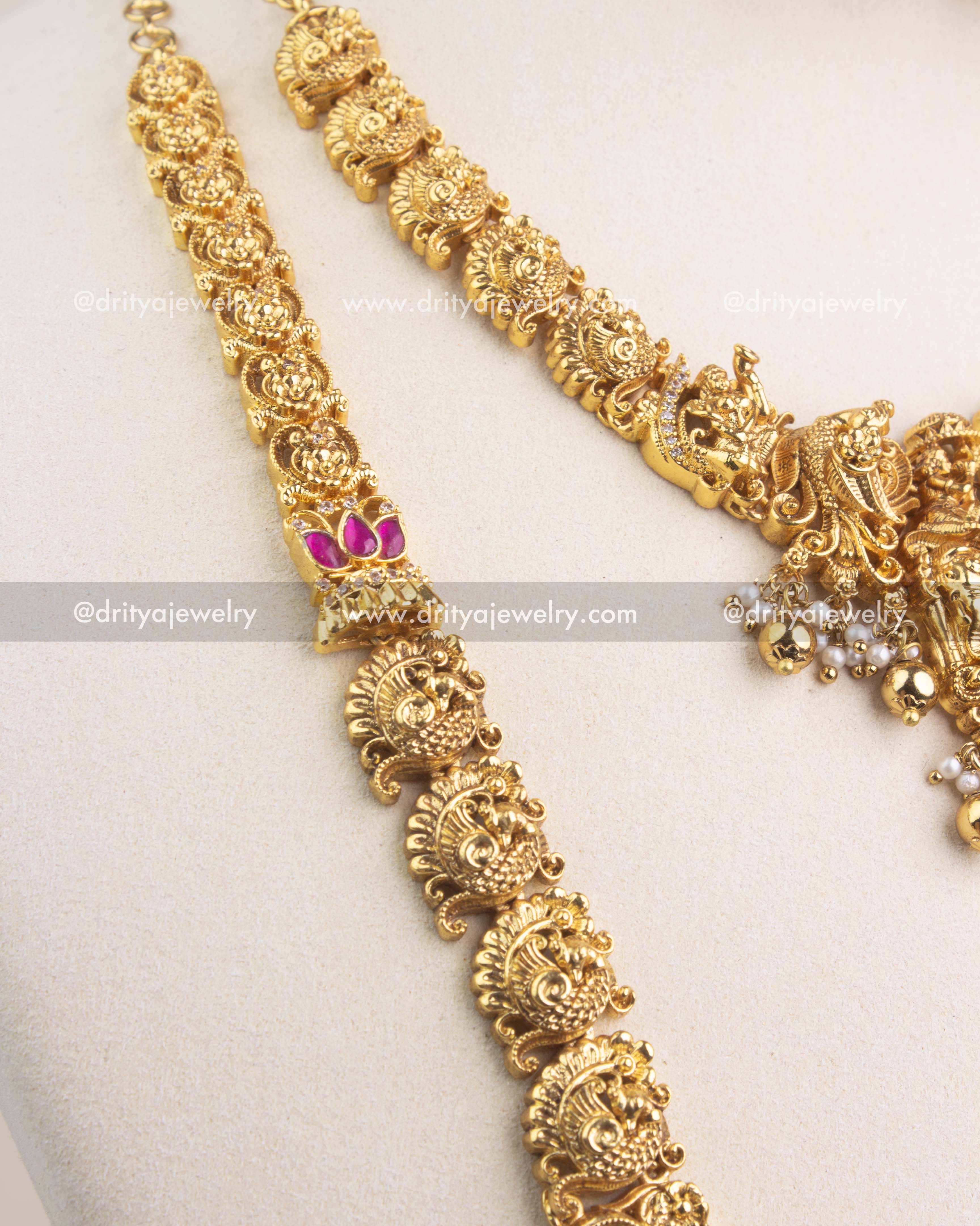 Nakshi chain design with peacock motifs and intricate antique gold work.