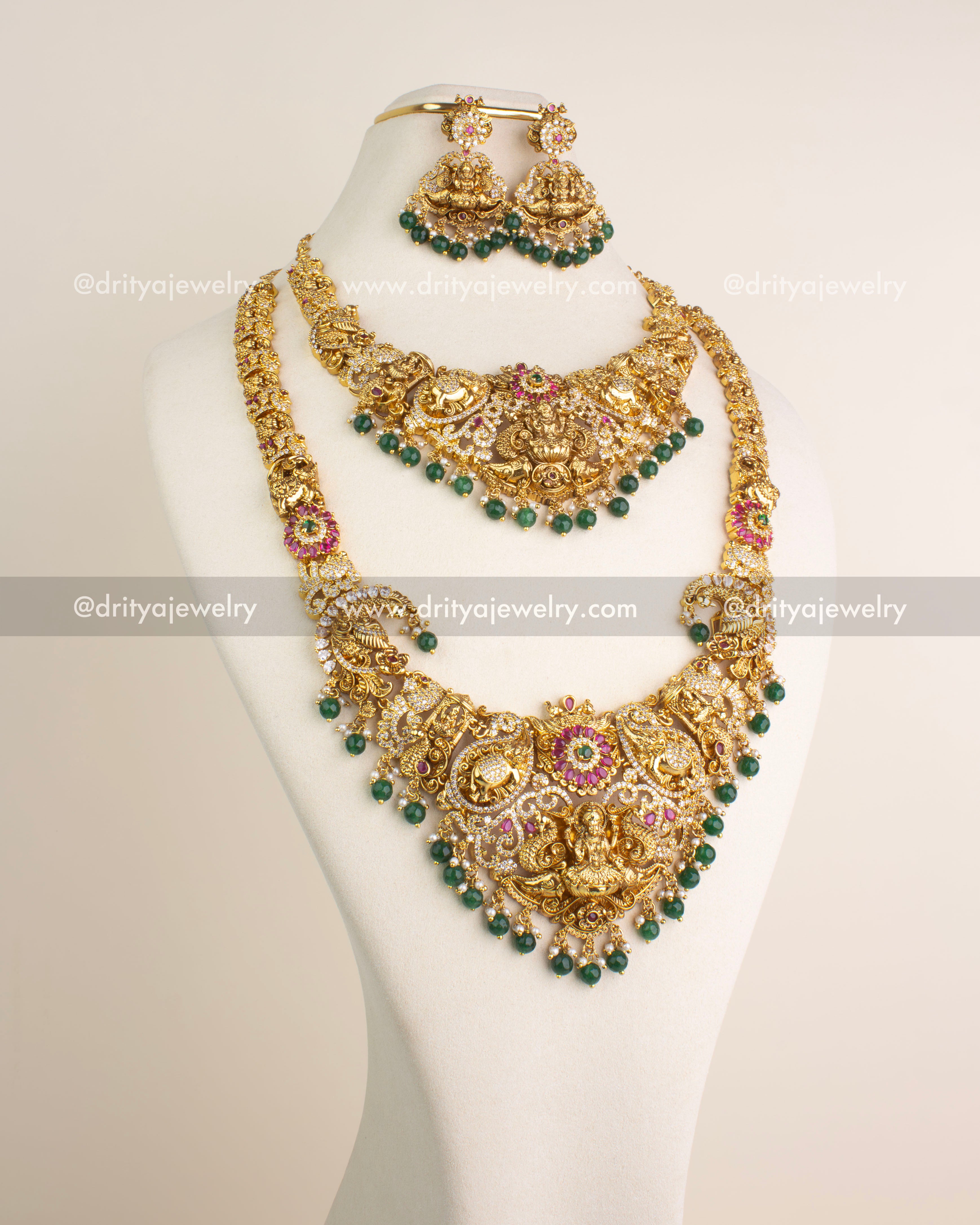 Temple jewelry combo set including long necklace, short necklace, and danglers with Lakshmi motifs and green bead hangings.