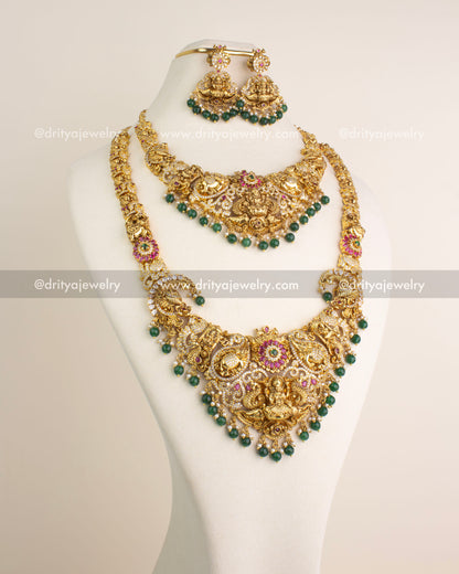 Temple jewelry combo set including long necklace, short necklace, and danglers with Lakshmi motifs and green bead hangings.