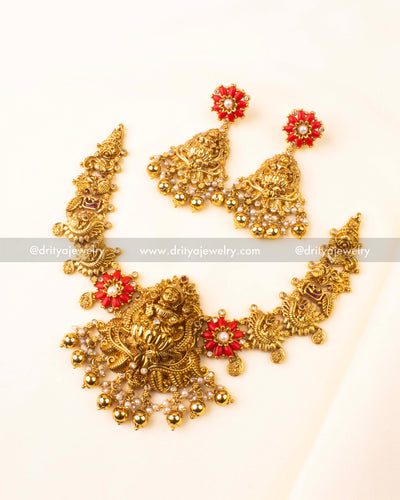 Short gold-plated nakshi necklace with coral beads and matching jhumka earrings
