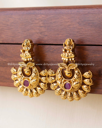 Gold-plated Nakshi earrings with Goddess Lakshmi design and ruby center stone