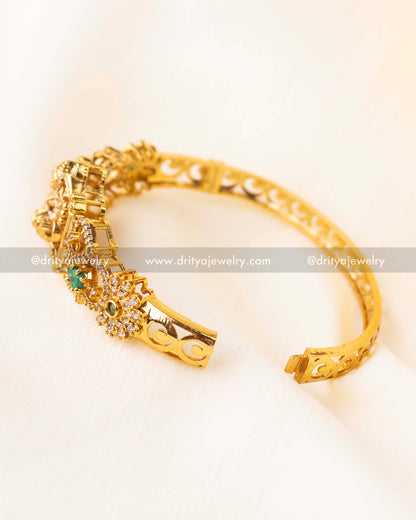 Openable temple-style kada with goddess Lakshmi motif and green stone accents