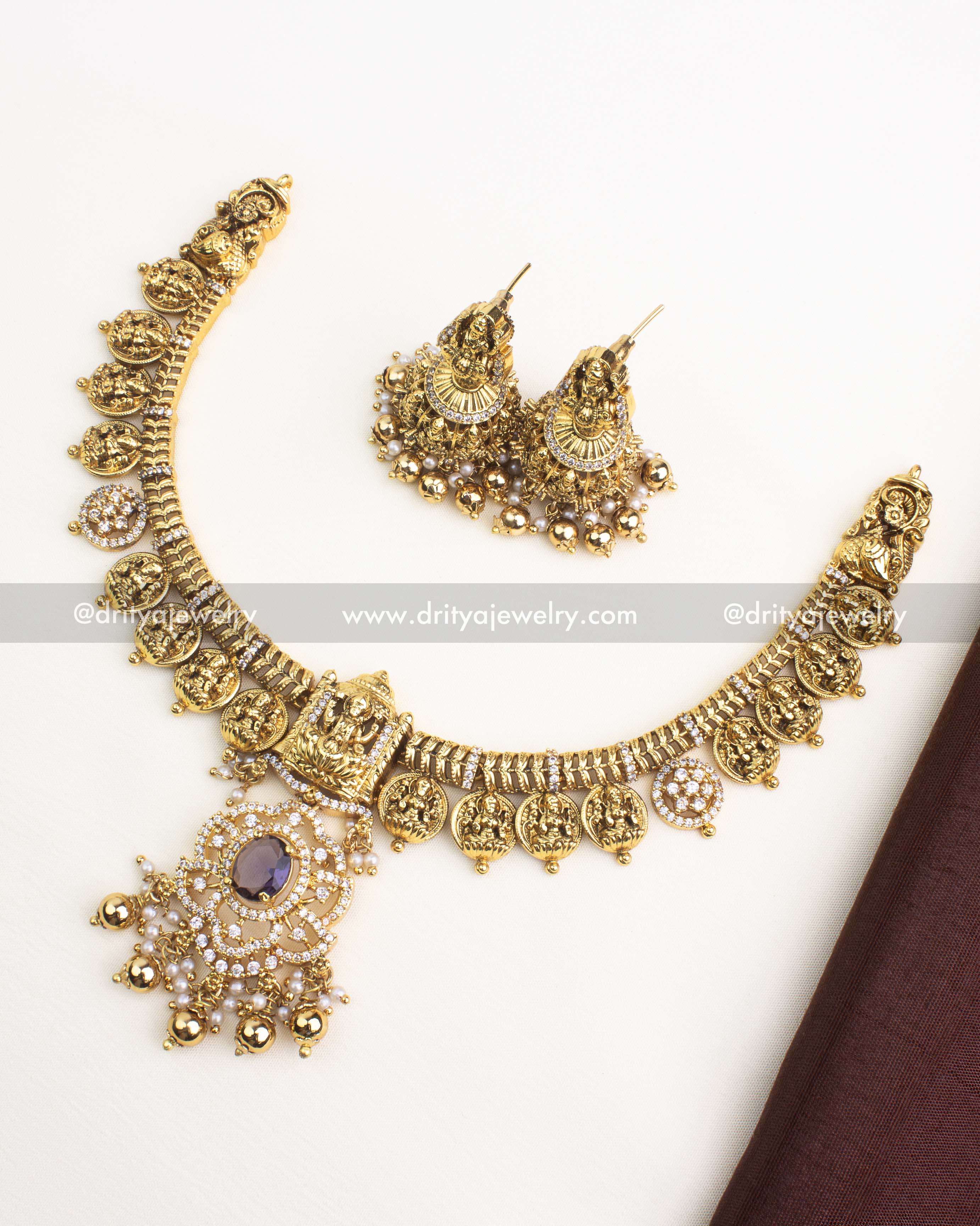 Antique gold Nakshi Kasulu short necklace with CZ stones and matching temple jhumka earrings.