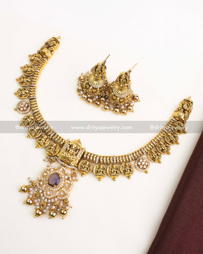 Antique gold Nakshi Kasulu short necklace with CZ stones and matching temple jhumka earrings.