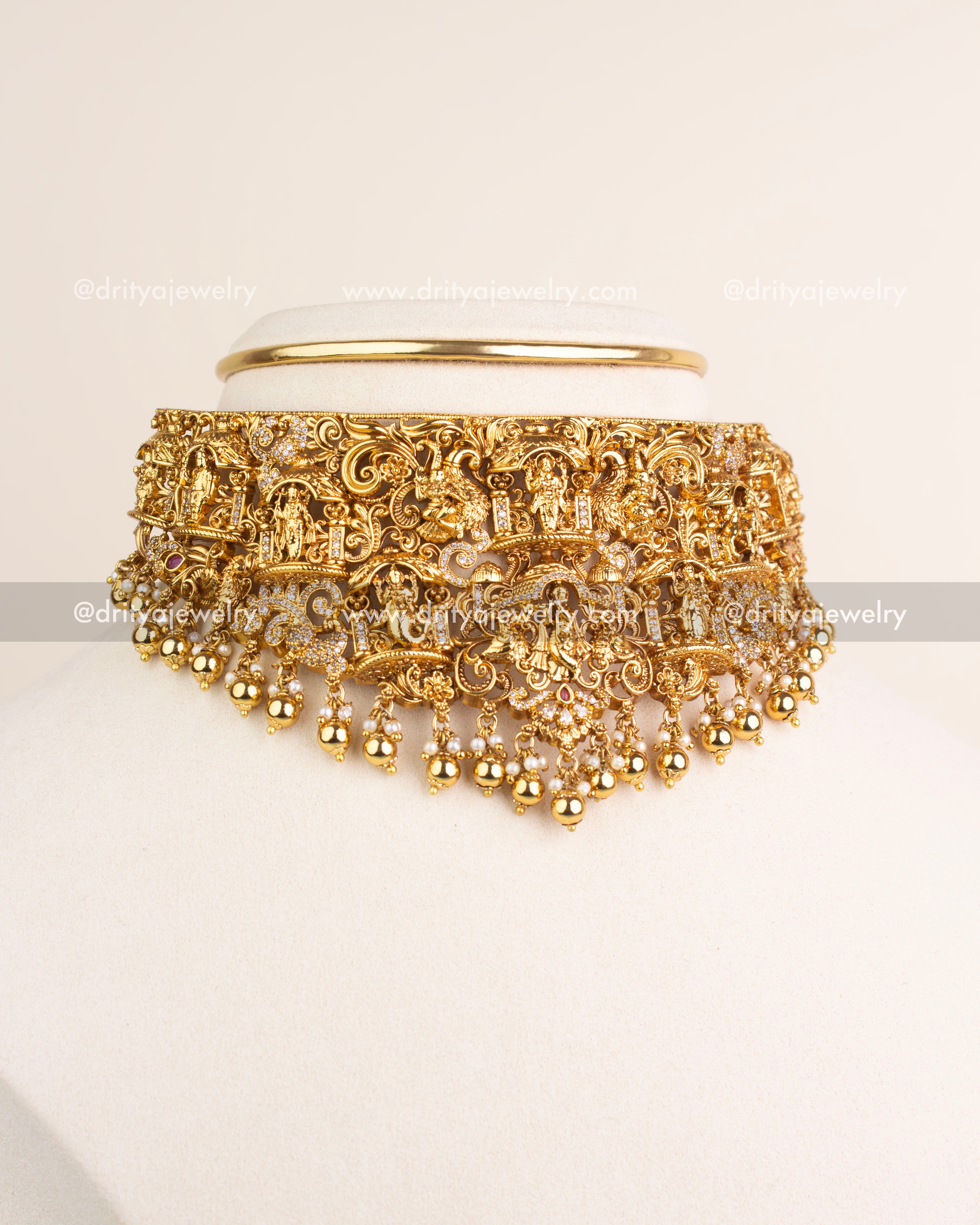Temple jewelry Nakshi choker with Krishna motif, CZ stones, and golden bead drops.