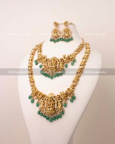 Traditional nakshi Lakshmi Devi necklace set with matching earrings and green bead drops.