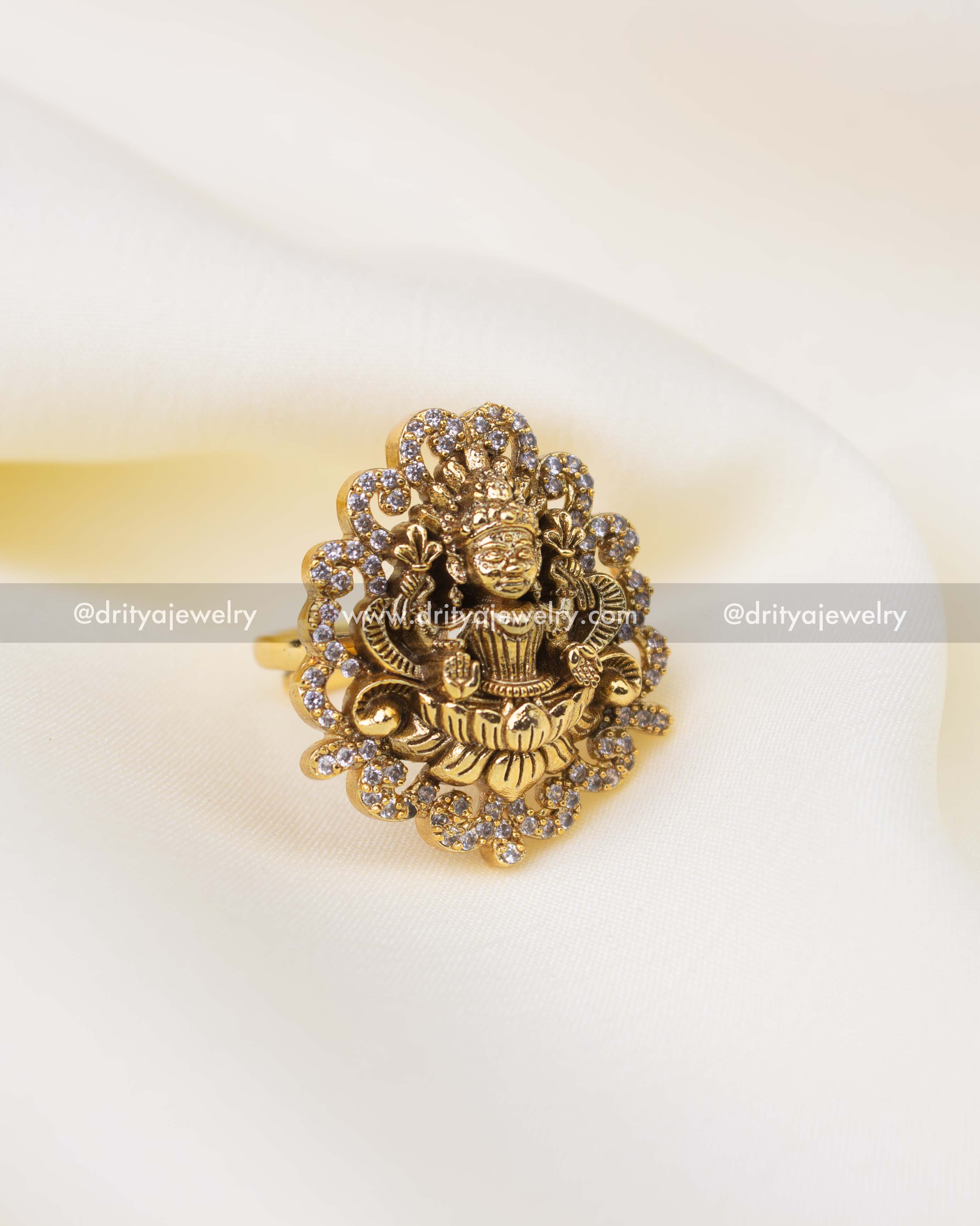 Antique gold Lakshmi temple ring with CZ stone detailing and Nakshi craftsmanship