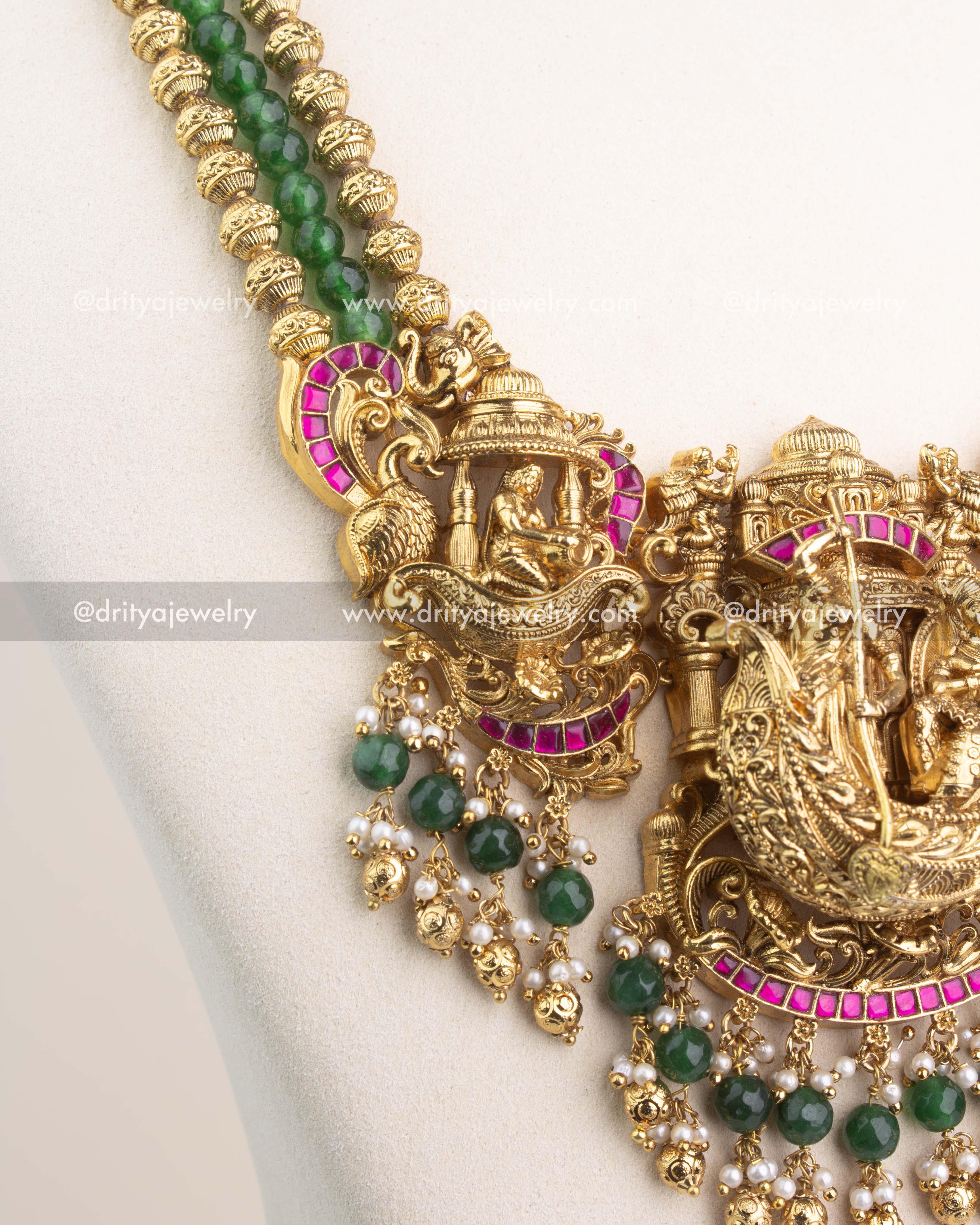 Close-up of intricate Nakshi carvings, temple domes, and ruby Kemp stone borders.