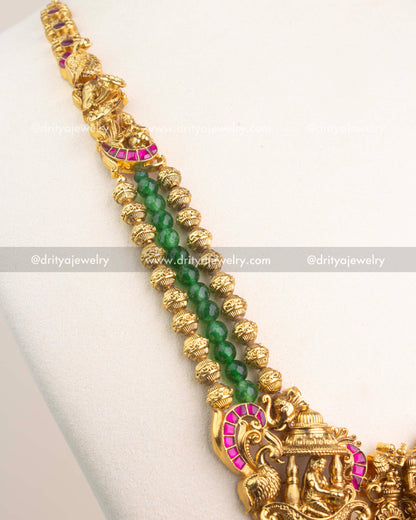 Close-up of intricate Nakshi carvings, temple domes, and ruby Kemp stone borders.