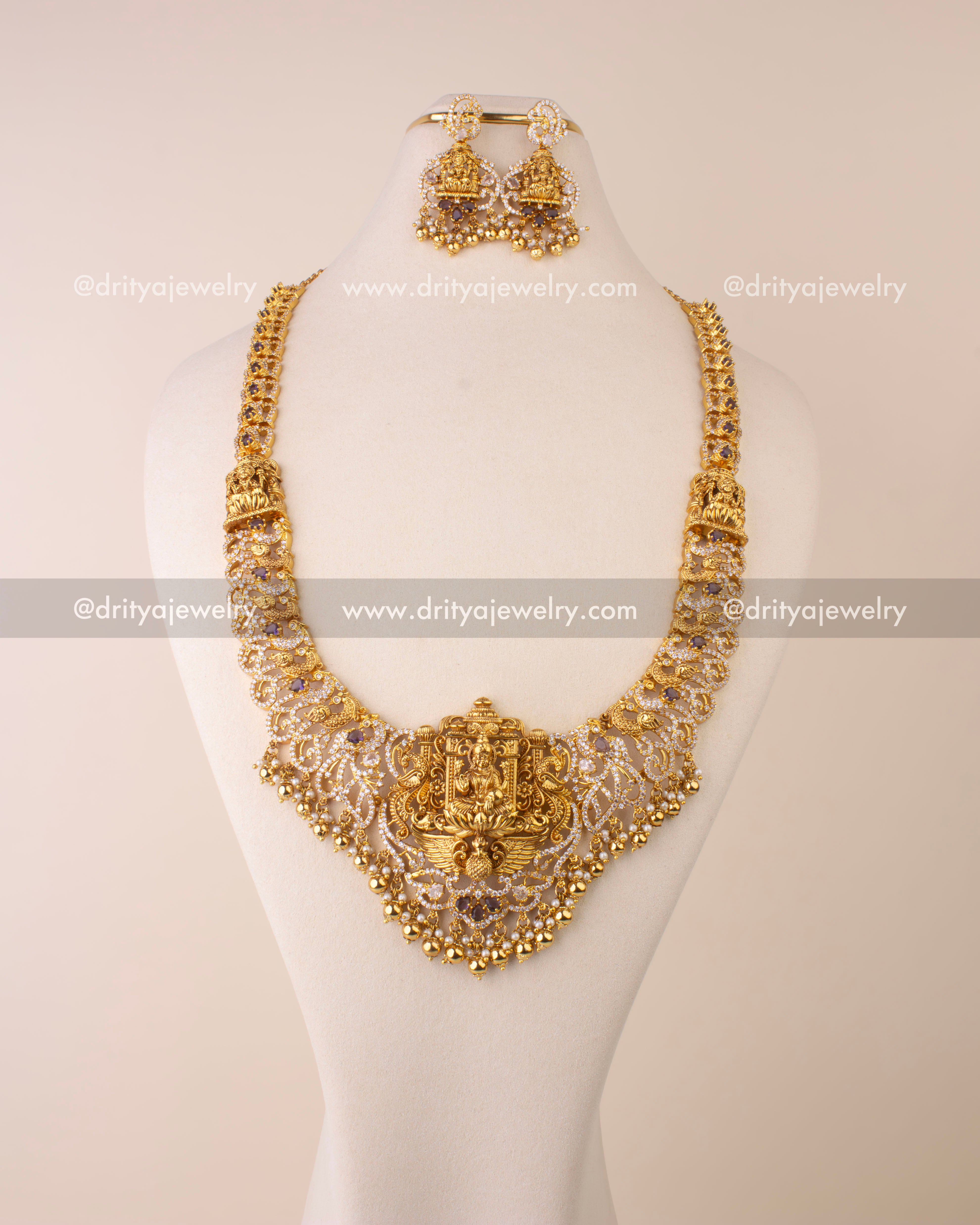 Nakshi long necklace featuring Goddess Lakshmi pendant, CZ stones, and golden bead hangings.