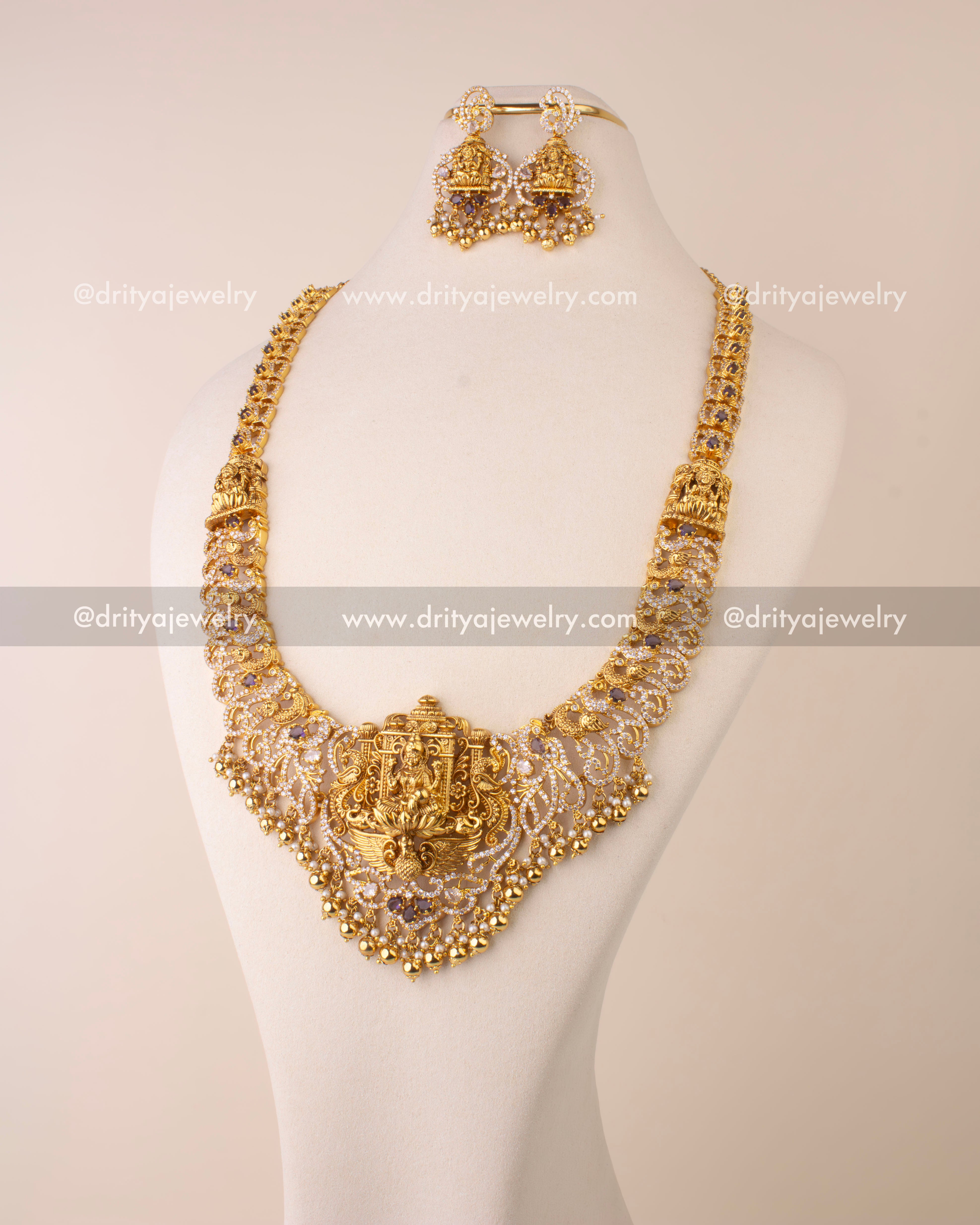 Nakshi long necklace featuring Goddess Lakshmi pendant, CZ stones, and golden bead hangings.