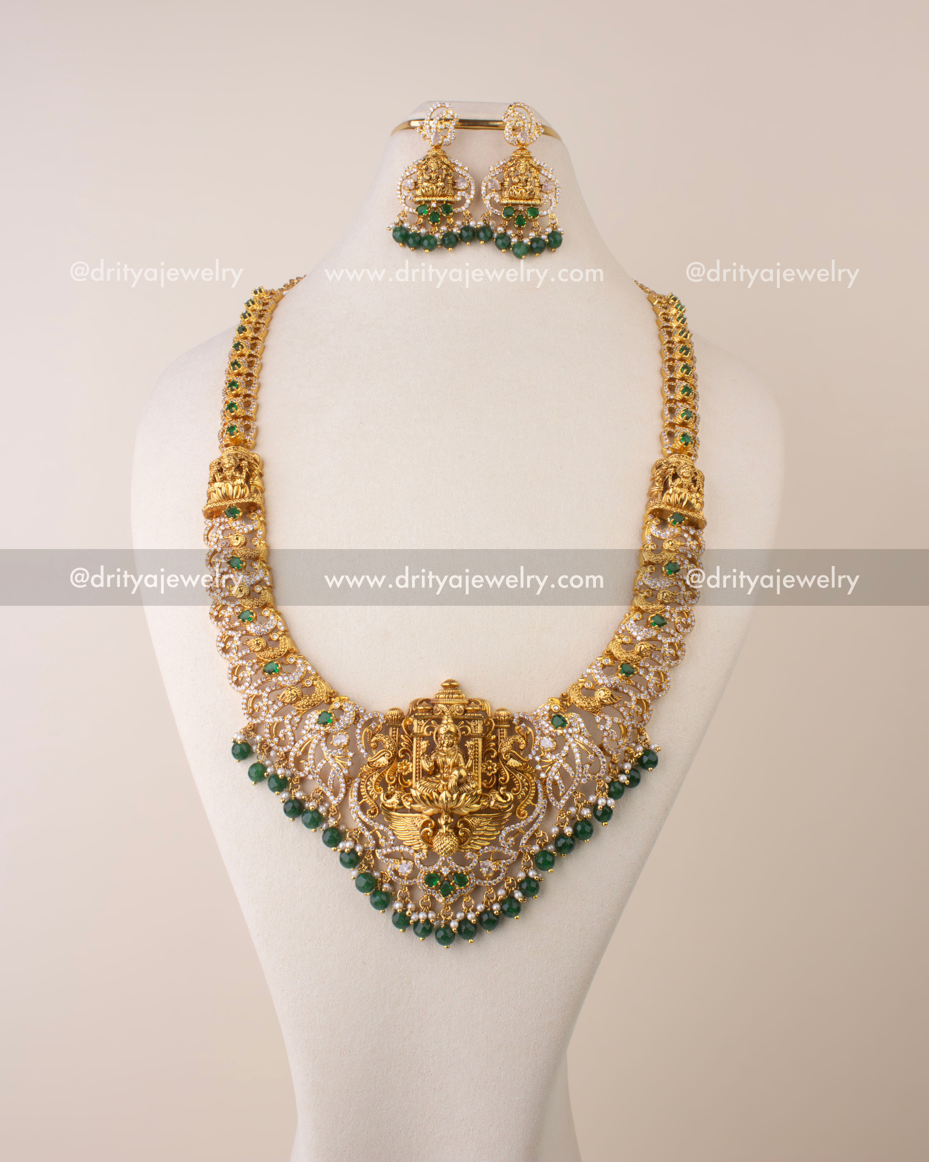 Traditional Nakshi long necklace featuring Goddess Lakshmi pendant with CZ stones, pearls, and green beads.