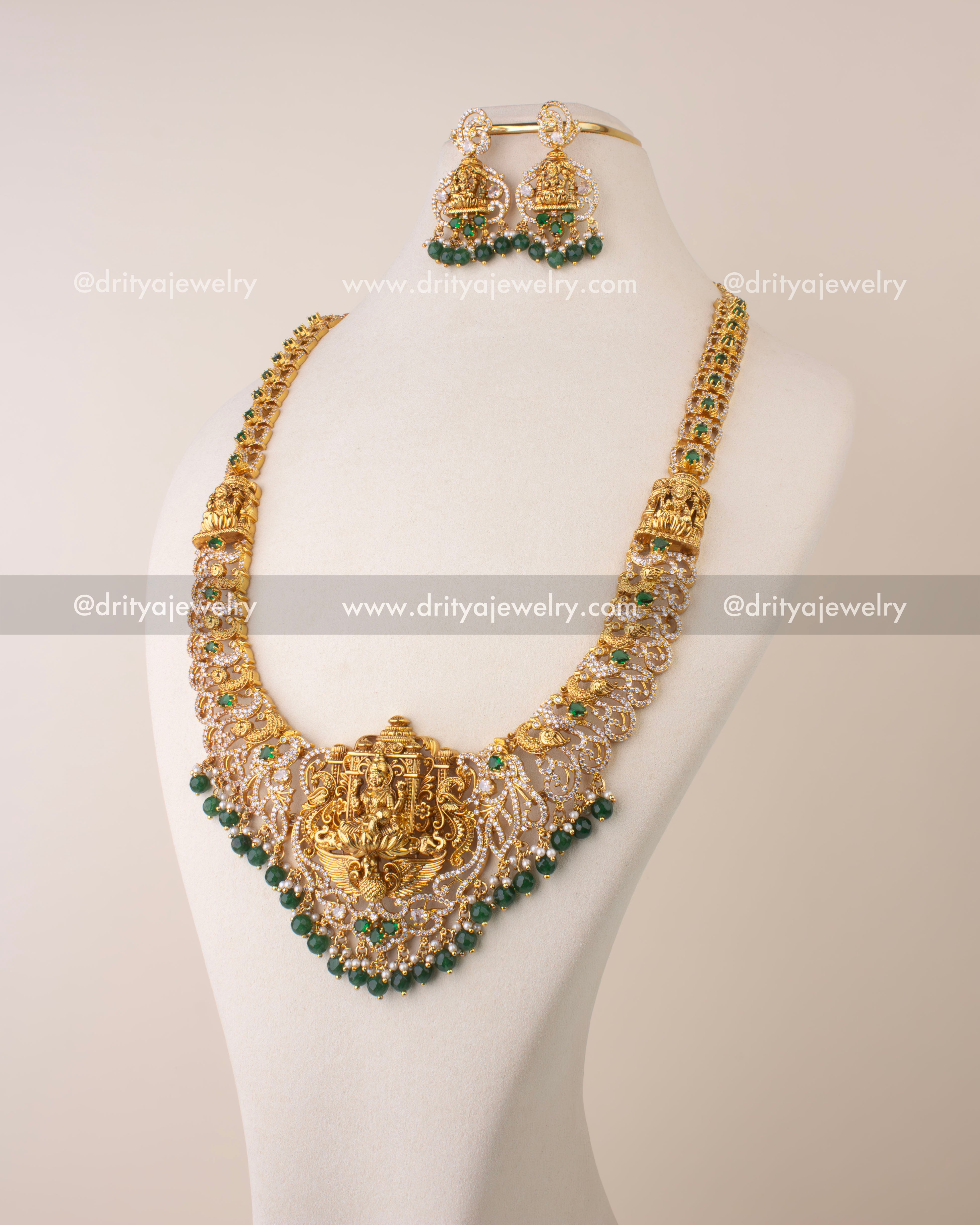 Traditional Nakshi long necklace featuring Goddess Lakshmi pendant with CZ stones, pearls, and green beads.