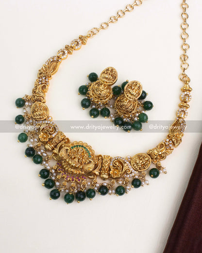 Temple-style Nakshi short necklace set with goddess motif, green beads, and mix stones.
