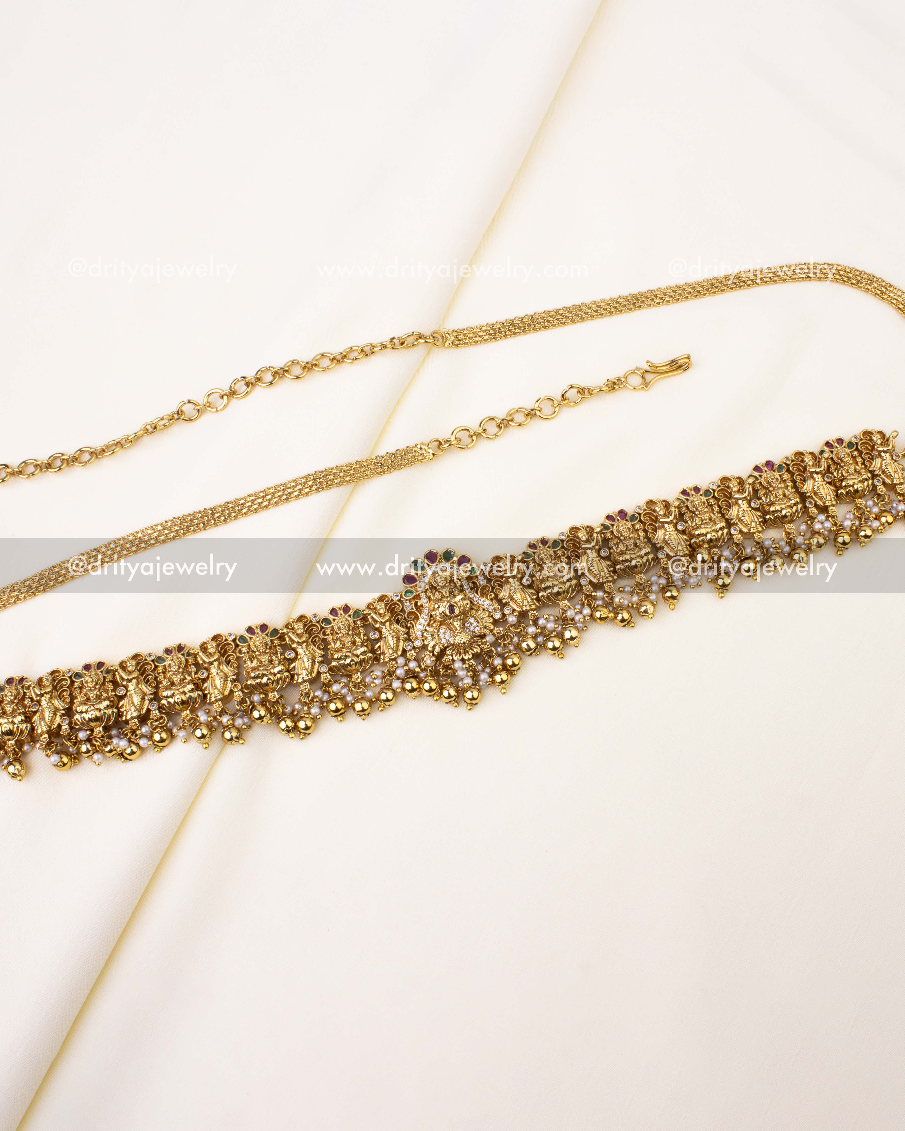 Premium Nakshi Temple Hip Belt with goddess motifs and pearl drops in antique gold polish.