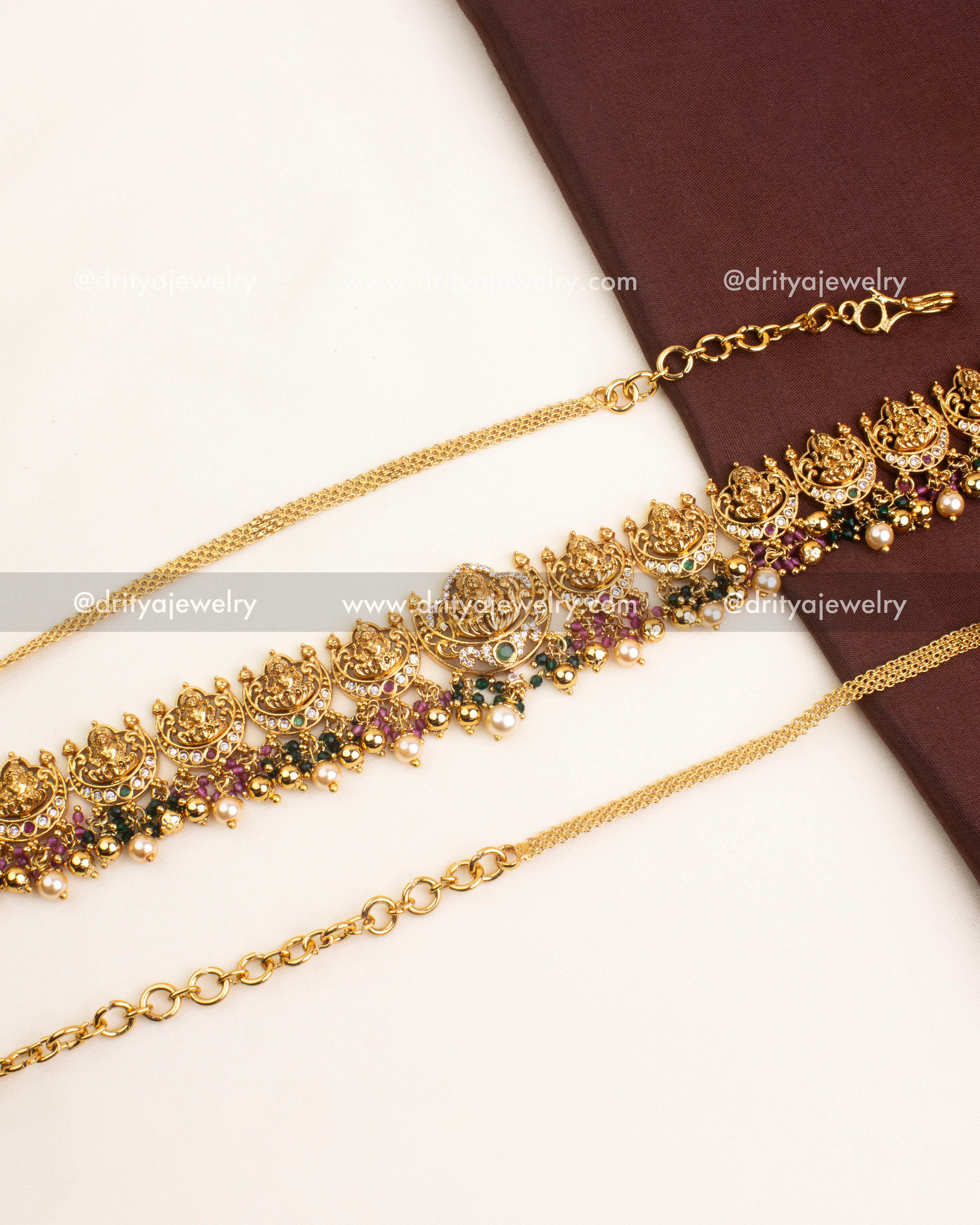 Antique temple hip chain featuring multiple Lakshmi motifs, CZ stones, and pearl hangings.