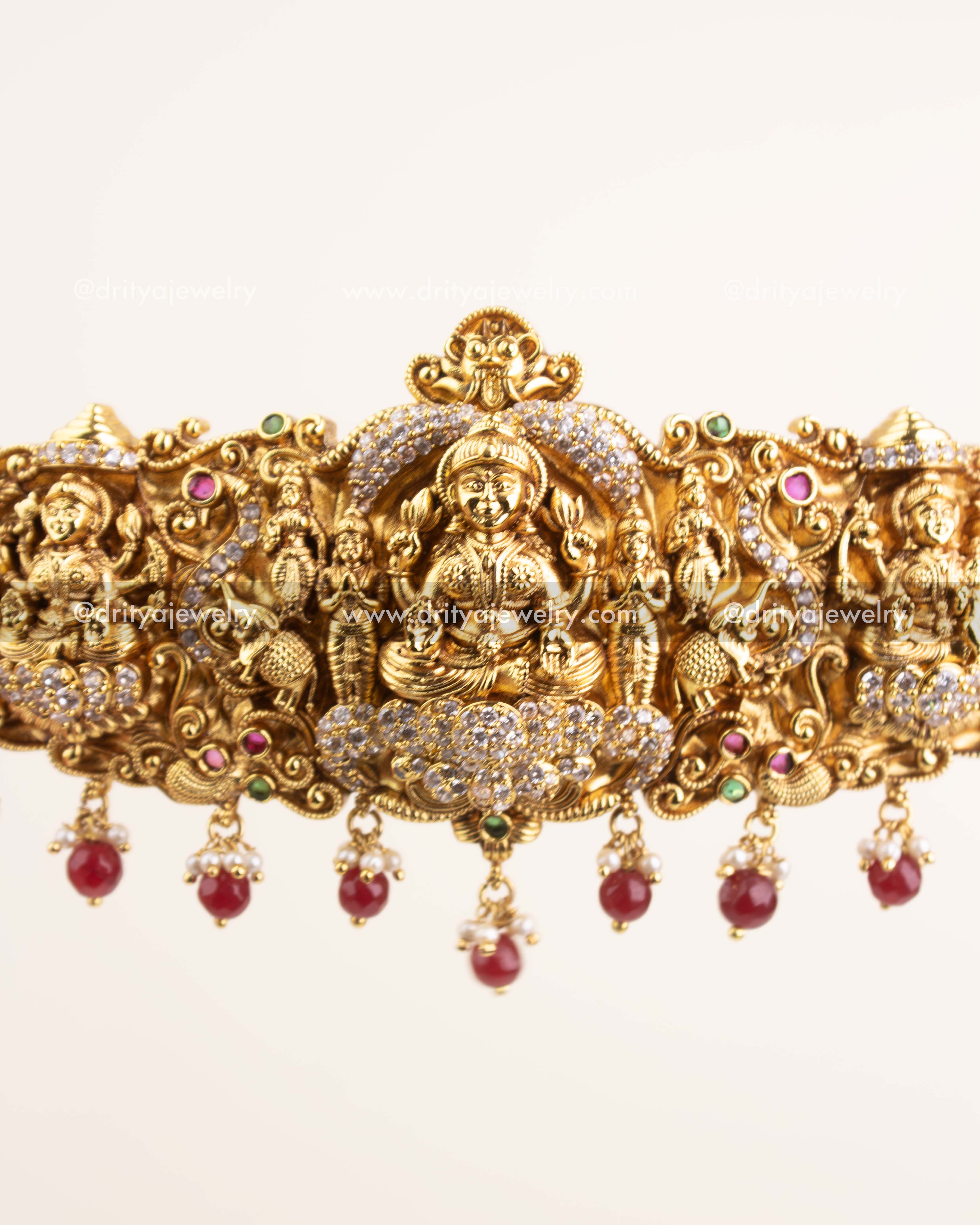 Detailed temple goddess design with CZ stones and ruby red beads.