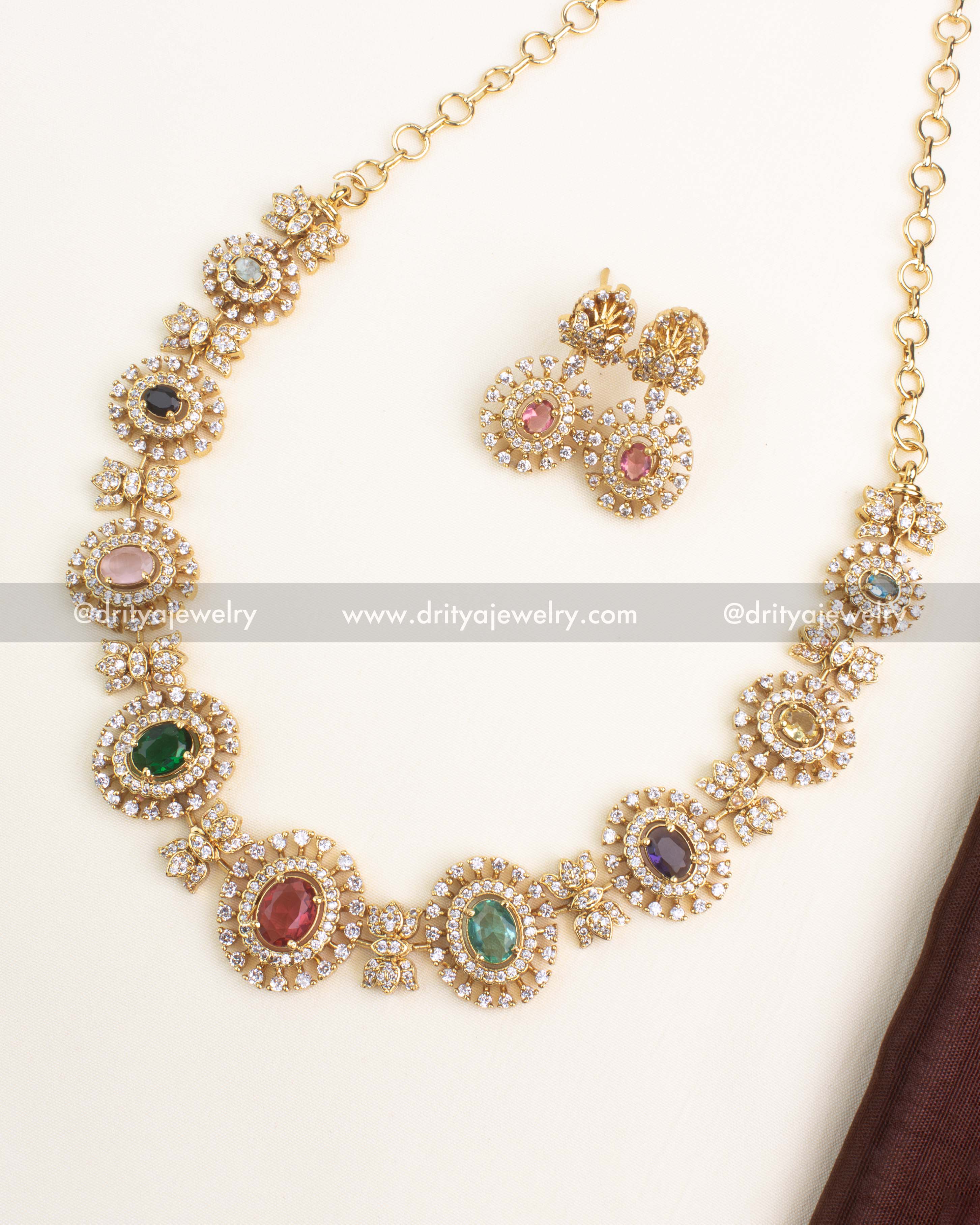 Gold-plated Navaratnalu short necklace set with multicolor CZ stones representing nine gems and matching earrings by Dritya Jewelry.